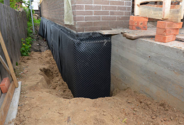 Happy homeowners after waterproofing job in Okauchee